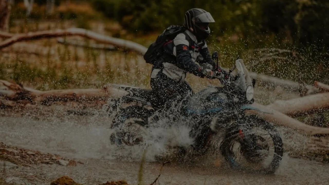 Himalayan 450 splashing through creek